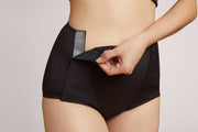 Black Adaptive Leakproof Underwear from Slick Chicks, offering comfort and easy wear.